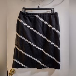 Style & CO black skirt size 6 with white stripe. Side zipper. Fits mid-length